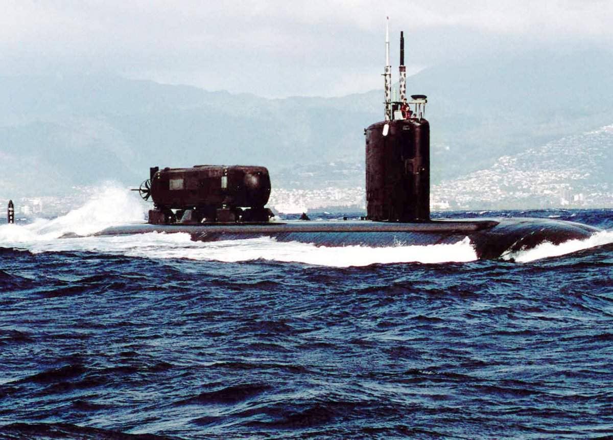 The prototype Advanced SEAL Delivery System submersible is seen here on top of the rear deck of the Los Angeles class attack submarine USS <em>Charlotte</em>. <em>USN</em>
