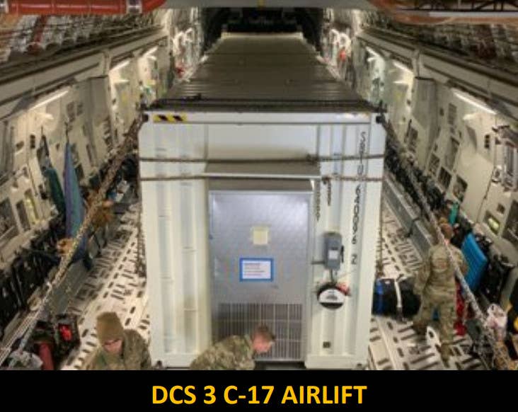 A low-quality picture showing a shipping container containing the third DCS prototype inside a C-17 cargo plane during a test. <em>SOCOM</em>