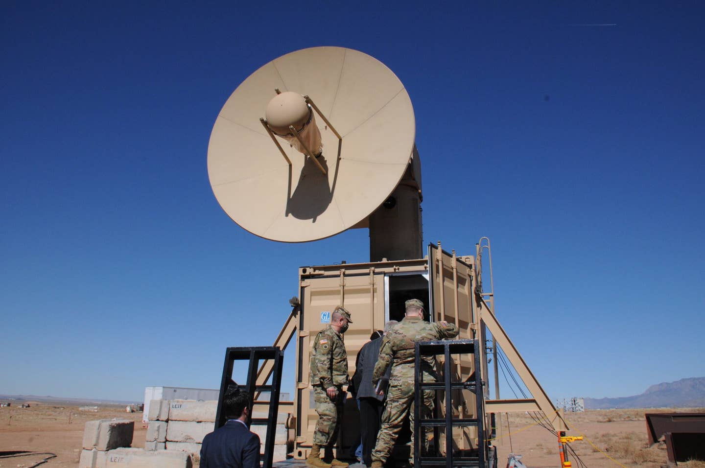 Leaders from the Army Rapid Capabilities and Critical Technologies Office enter the portable control center of Air Force Research Laboratory’s Tactical High Power Operational Responder, or THOR, to view the system’s drone-killing capabilities, February 11, 2021, at Kirtland Air Force Base, New Mexico. <em>U.S. Air Force photo by John Cochran</em><br>