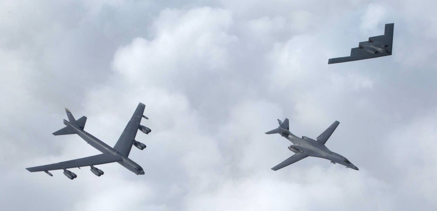 Examples of all three of the Air Force's current bombers fly together. From left to right, the B-52, the B-1, and B-2. <em>USAF</em>