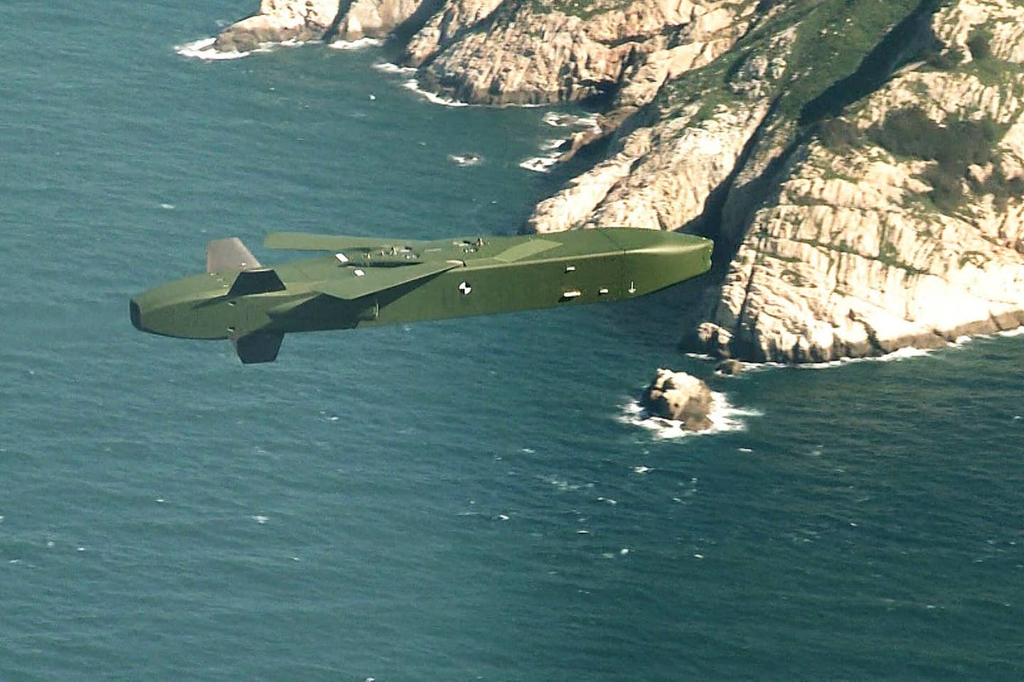 A Taurus missile in flight, with the pop-out wings above the body seen deployed. <em>Photo by South Korean Defense Ministry via Getty Images</em>