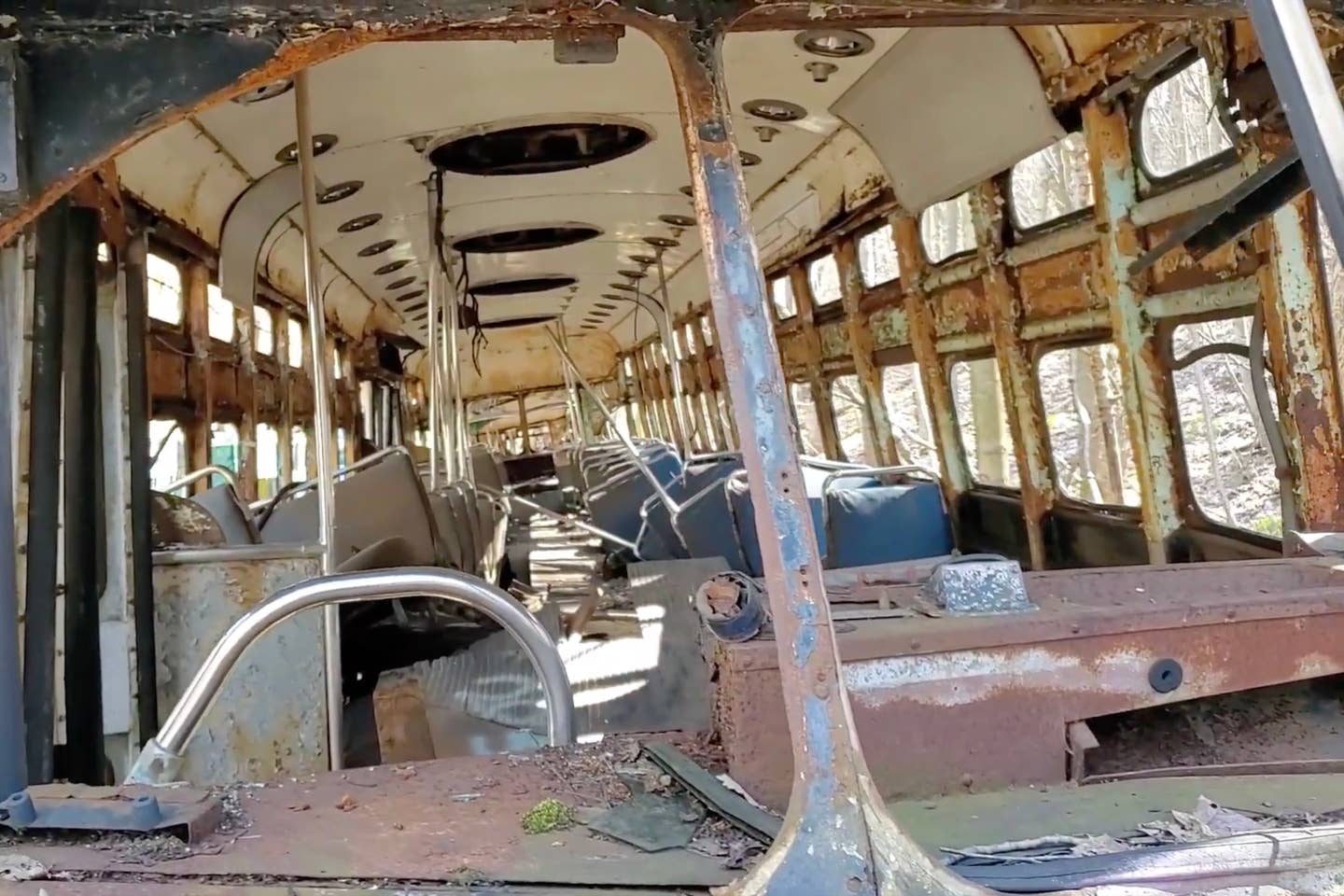Inside a decrepit trolley at the Vintage Electric Streetcar Company. <em>YouTube, JOEY_UNDERGROUND</em>