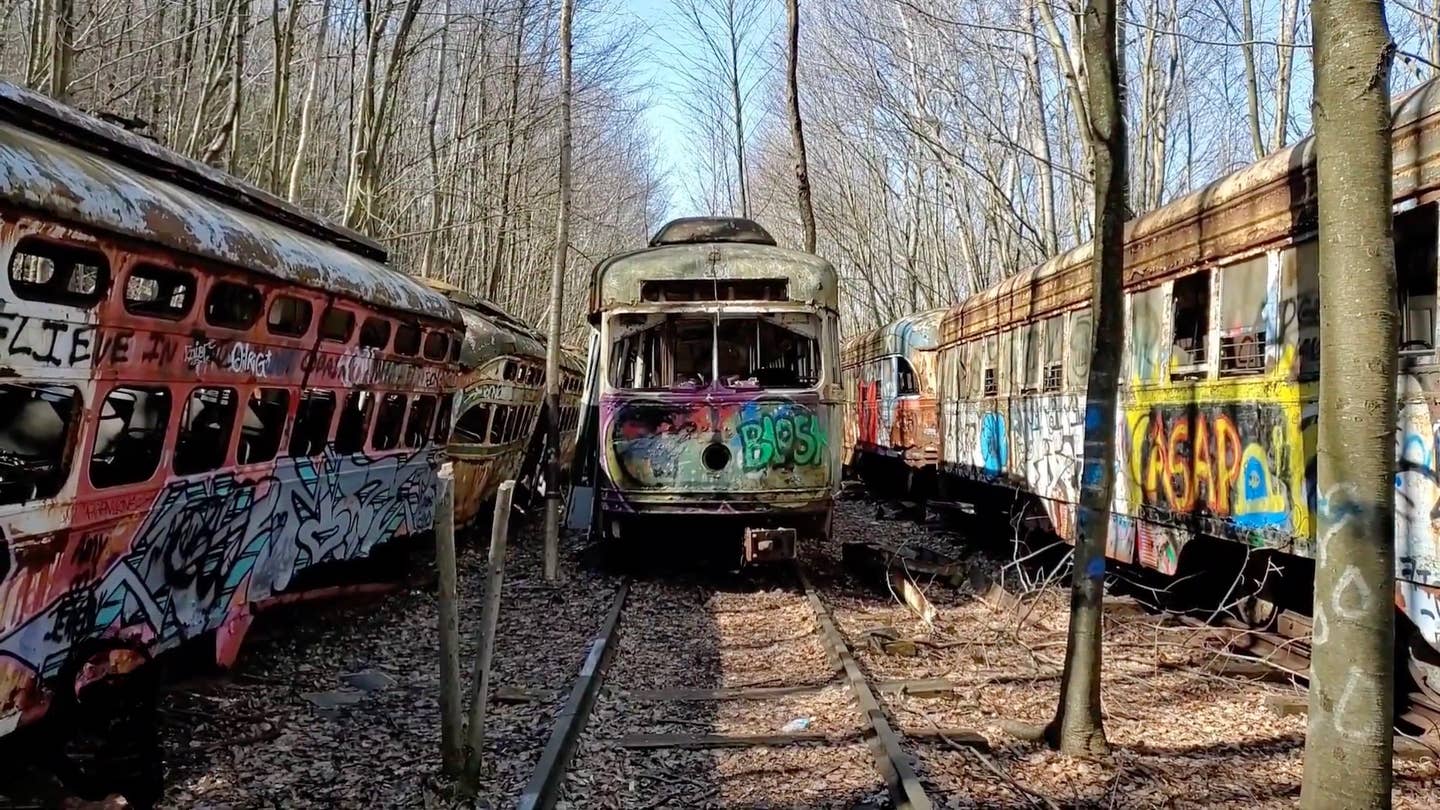Historic trolleys rust away in a forest in Pennsylvania