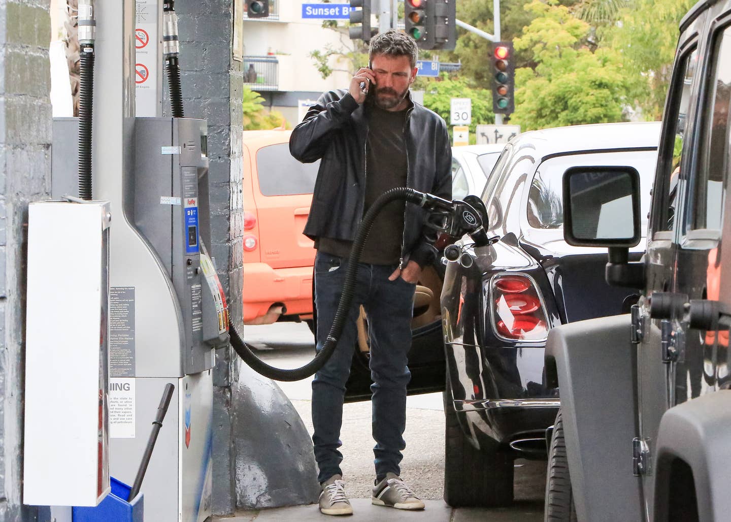 Ben Affleck looks a little concerned on the phone here—maybe he's calling the shop to make sure he picked the right octane for his Bentley. <em>Bauer-Griffin/GC Images via Getty</em>