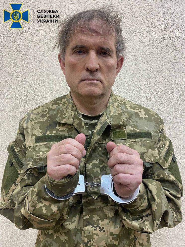 Fugitive oligarch and President Vladimir Putin’s close friend Viktor Medvedchuk is seen handcuffed after a special operation was carried out by the Security Service of Ukraine in Ukraine on April 12, 2022. <em>Photo by Security Service of Ukraine/Anadolu Agency via Getty Images</em>