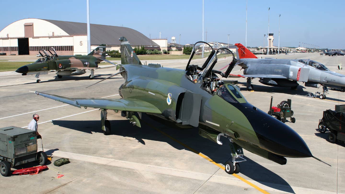 The flight line at the 82nd ATRS in 2004 with two "Heritage" painted QF-4Es and a standard gray and red example in the background. <em>Jamie Hunter</em>