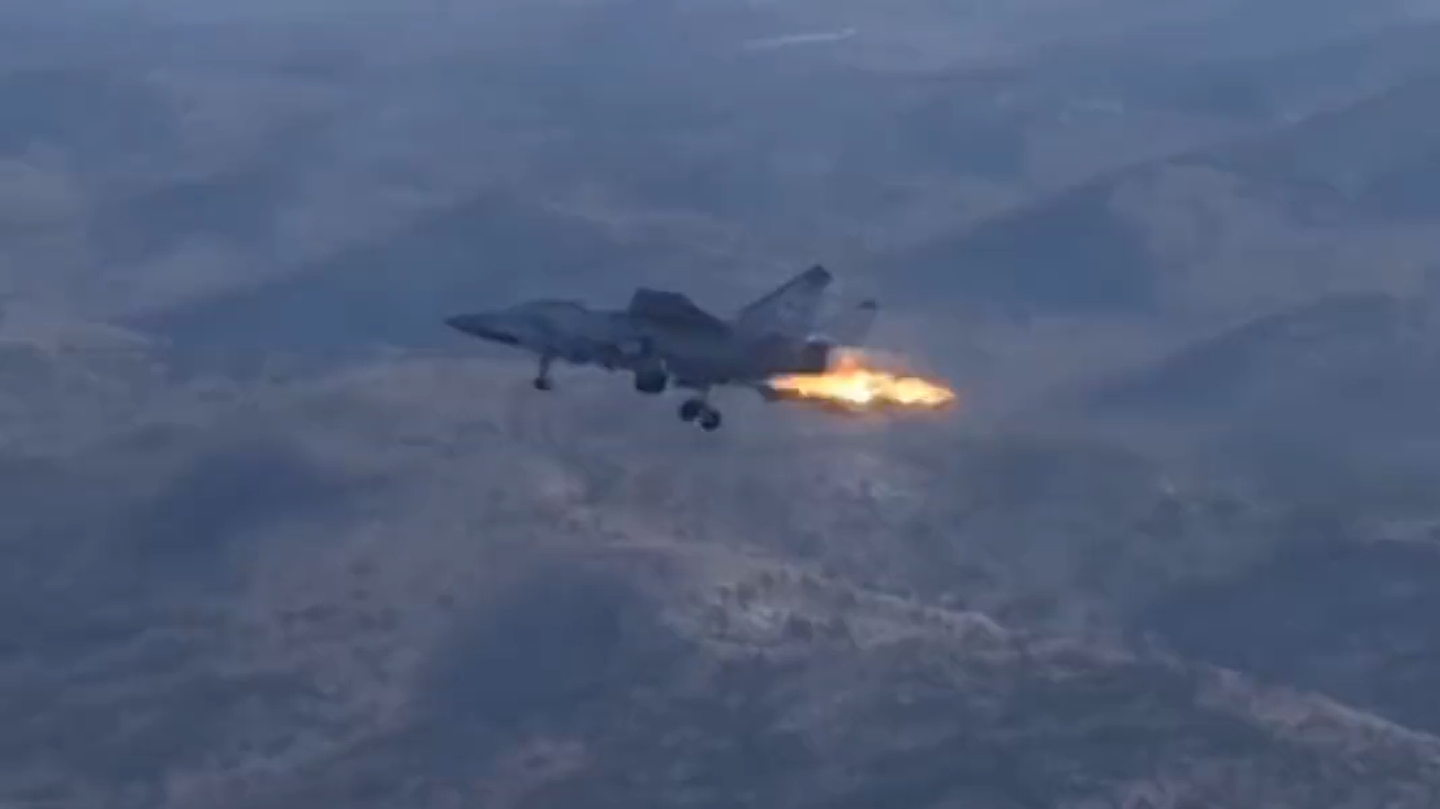A Russian Air Force MiG-31 Foxhound trails fire from near its engines in an undated video. <em>Via @Fighterbomber on Telegram</em>.