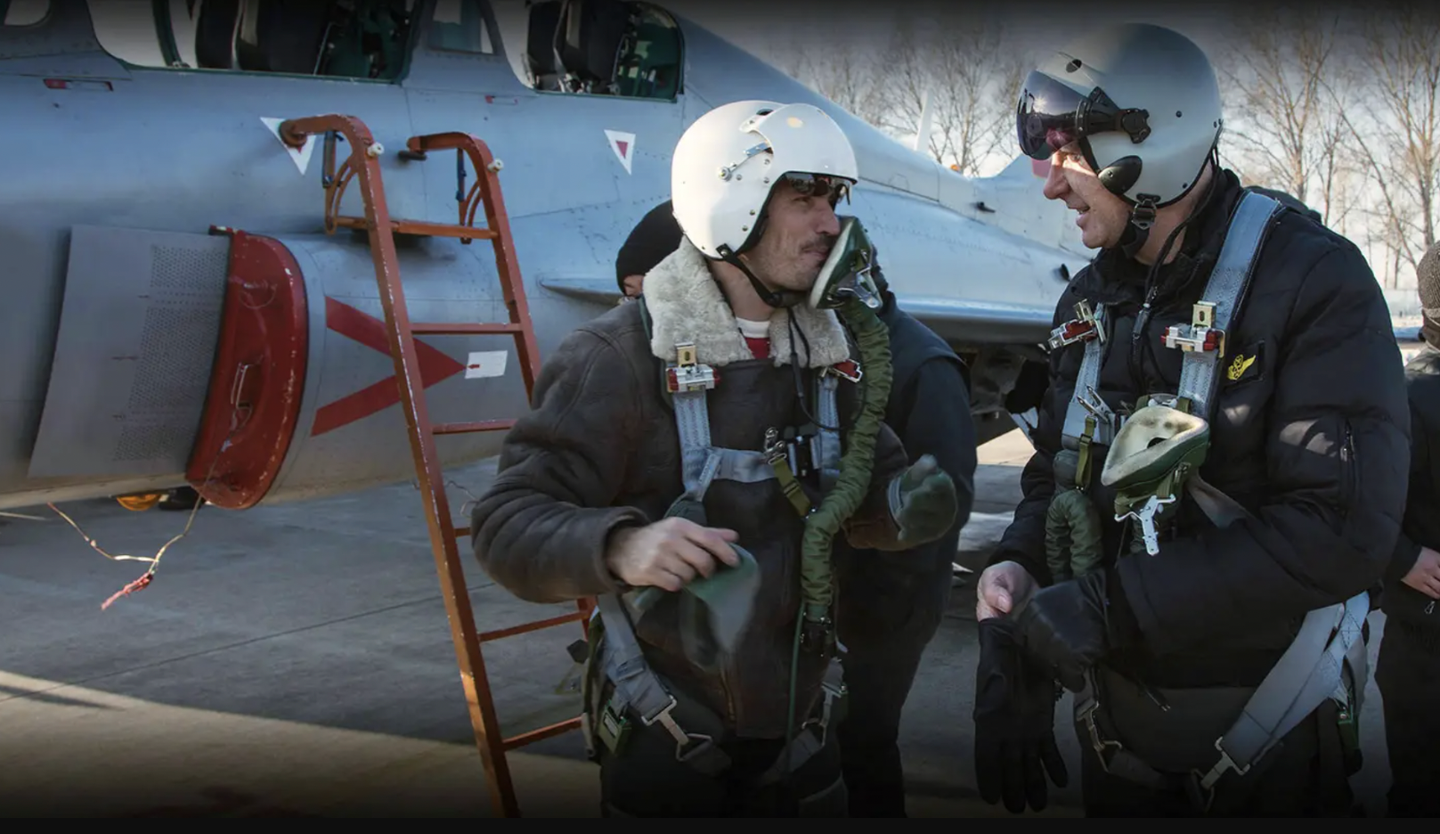 An image from the TFASA website apparently showing Western aircrew in front of a Chinese FTC-2000 jet trainer.&nbsp;<em>TFASA</em>