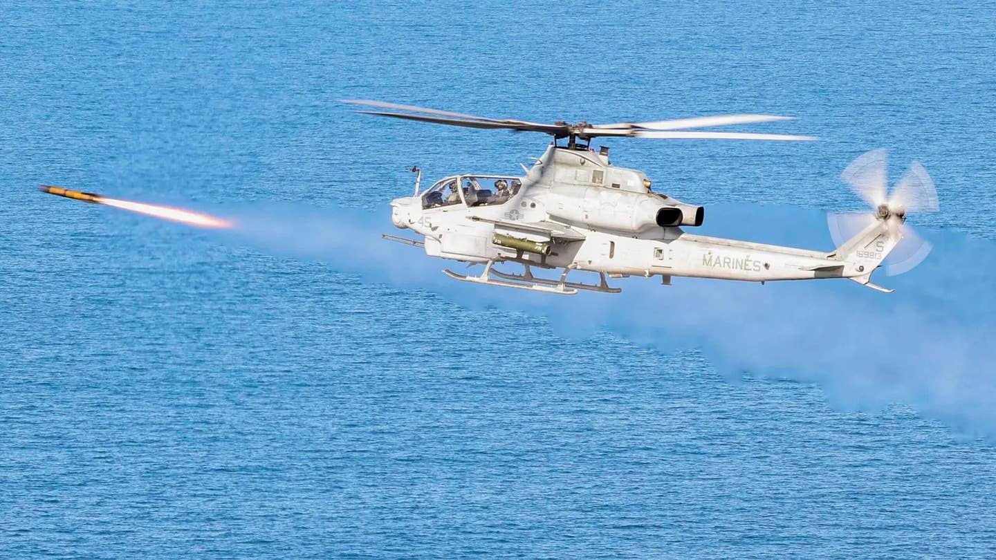 A Marine AH-1Z fires an AGM-179A Joint Air-to-Ground Missile during a test. <em>USMC</em>