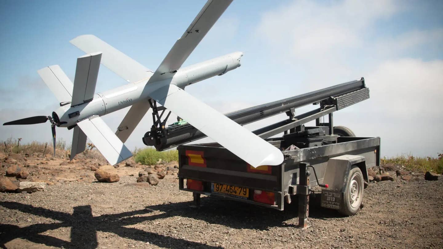 A UVision Hero-400 loitering munition on a trailer-mounted catapult launch system during a Marine Corps test in 2022. <em>USMC</em>