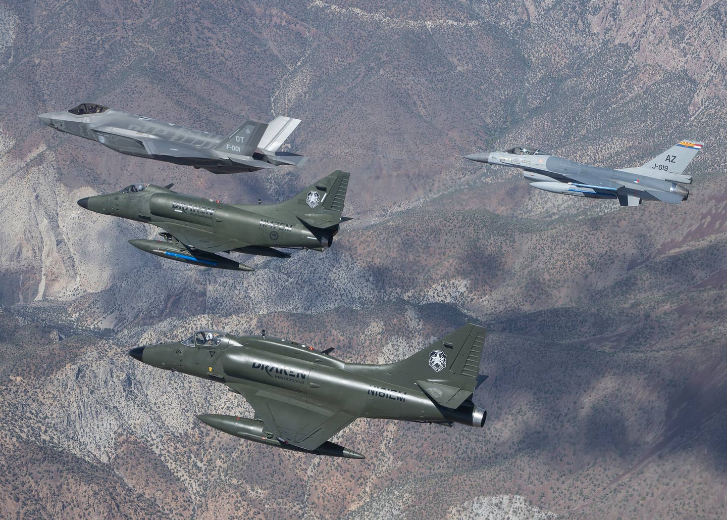 A Dutch F-35A, a Dutch F-16, and a pair of Draken International A-4 Skyhawks fly in support of an operational test exercise for the Royal Netherlands Air Force contingent at Edwards Air Force Base, California. <em>Photo courtesy Frank Crebas</em><br><a href="https://www.edwards.af.mil/News/Article/828636/a-4-skyhawks-support-f-35-operational-testing/undefined"></a>
