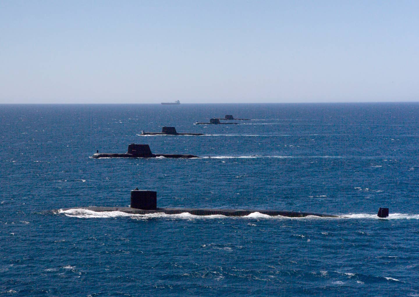 The <em>Los Angeles</em> class&nbsp;submarine USS <em>Santa Fe</em> transits in formation on the surface with Royal Australian Navy <em>Collins</em> class submarines HMAS <em>Collins</em>, HMAS <em>Farncomb</em>, HMAS <em>Dechaineux</em>, and HMAS <em>Sheean</em> in the West Australian Exercise Area, in February 2019. <em>Australian Department of Defense</em>