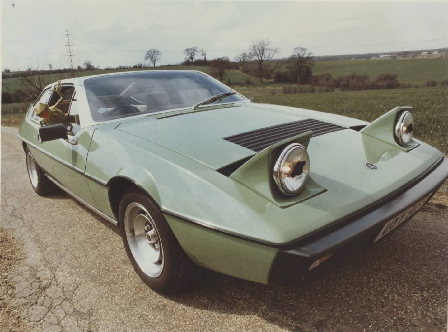 Jim Henson's 1978 Lotus Éclat with its short-lived Kermit the Frog pupils. Kermit himself leans out of the driver's window.