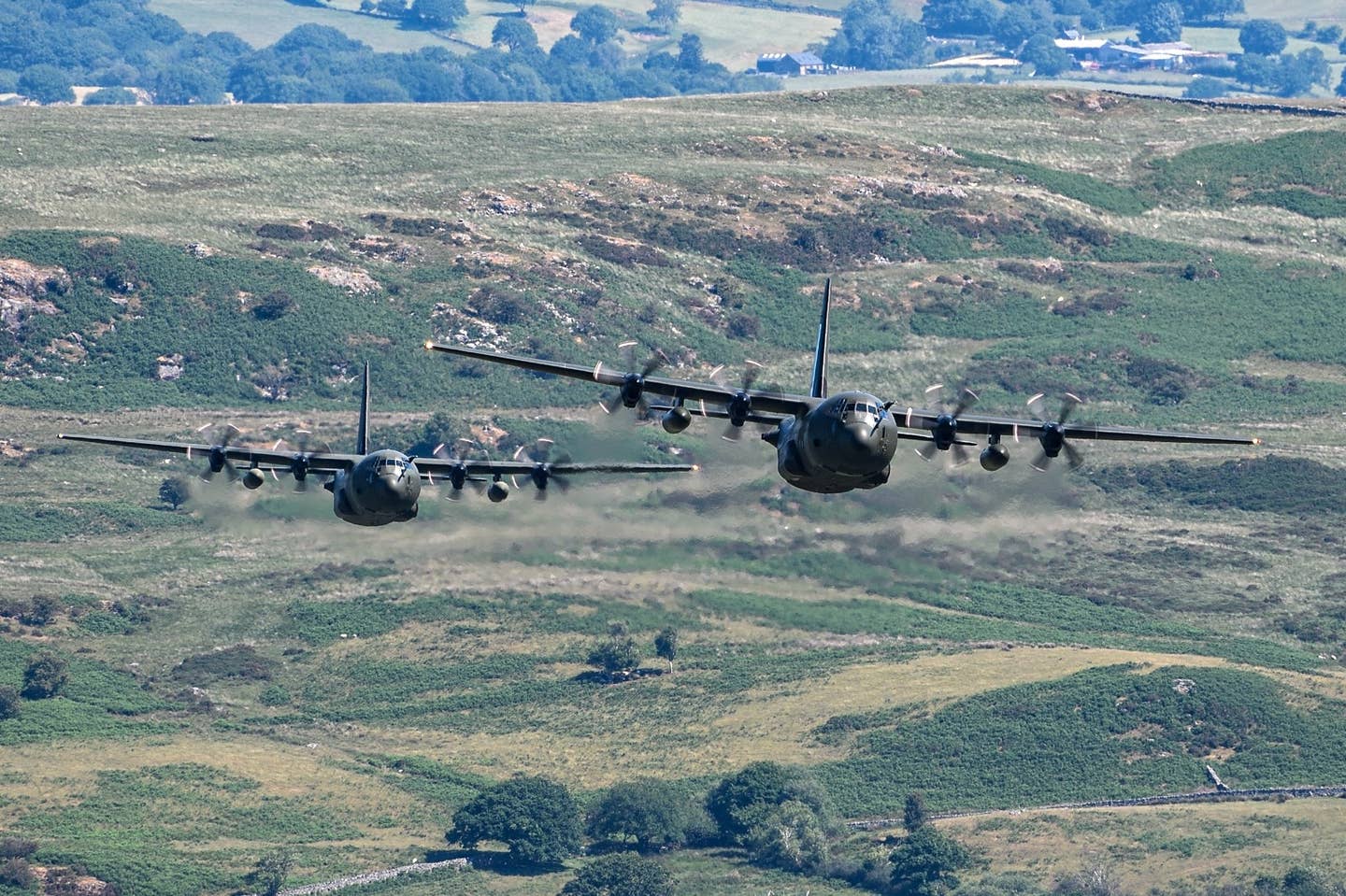 Two of the three C-130Js pictured above the Mach Loop, west-central Wales. <em>Jamie Hunter</em>