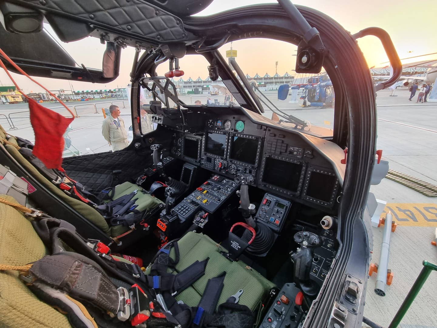 The cockpit of the upgraded Ka-52M version, showing the side-by-side seating and the handles to initiate the crew extraction sequence in an emergency. <em>Mztourist/Wikimedia Commons</em>