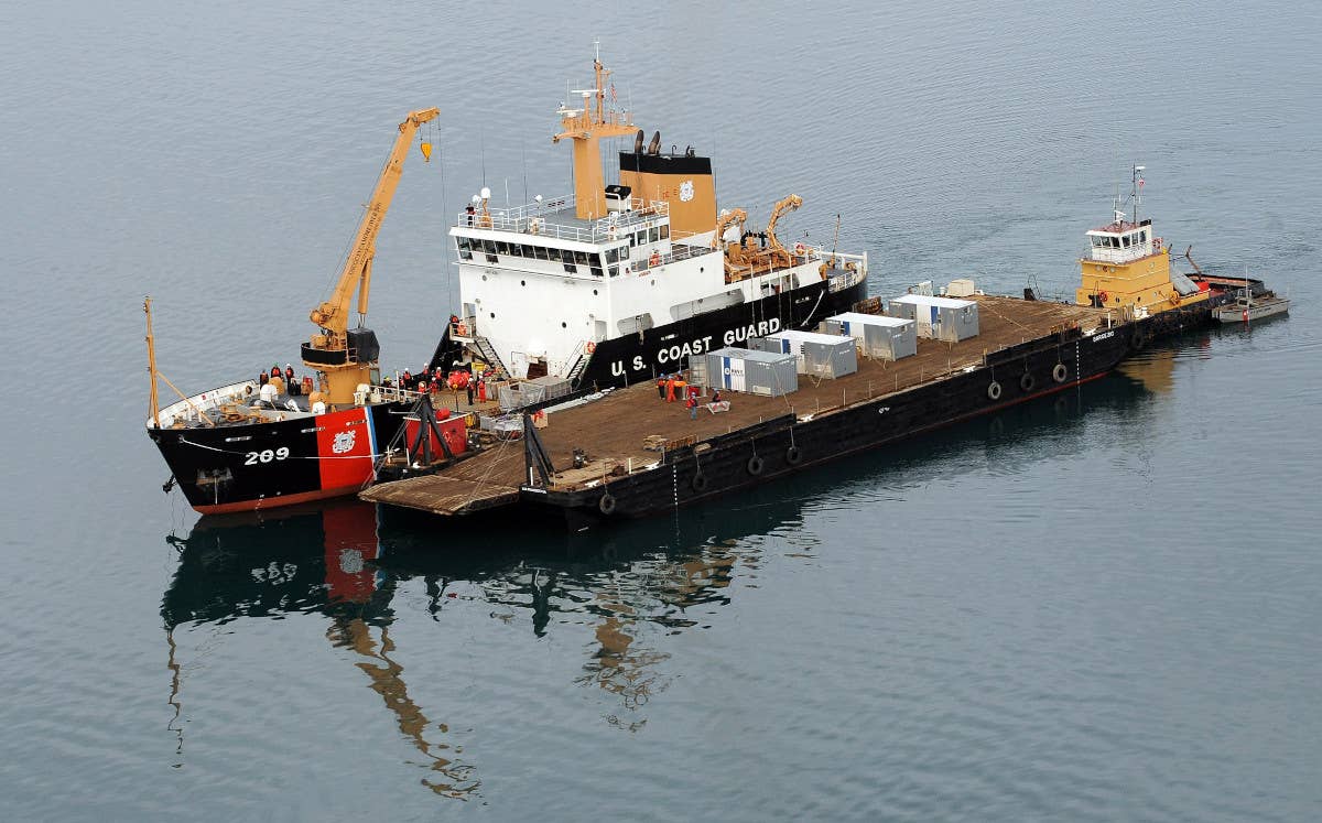USCGC&nbsp;<em>Sycamore</em>, anchored alongside a barge, while participating in the U.S. military exercise Arctic Edge 2012. <em>USCG</em>