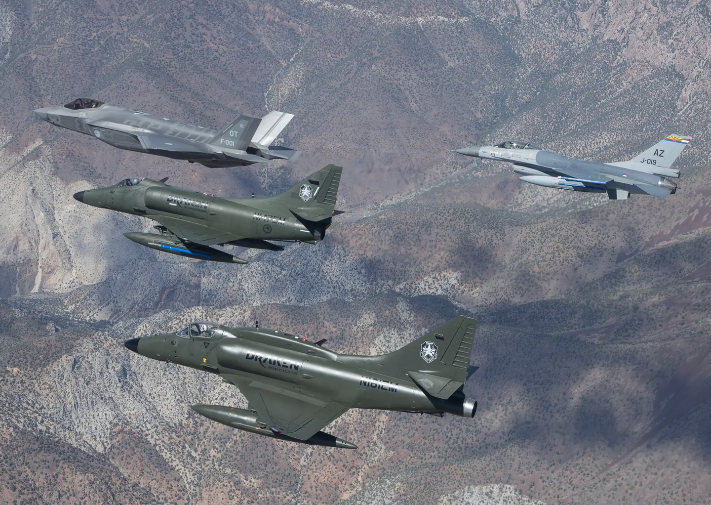 A Dutch F-35A, a Dutch F-16, and a pair of Draken International A-4 Skyhawks fly in support of an operational test exercise for the Royal Netherlands Air Force contingent at Edwards Air Force Base, California.&nbsp;<em>Photo courtesy Frank Crebas</em>