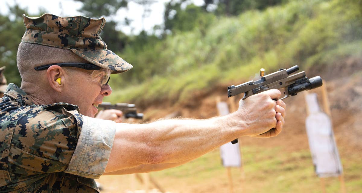 A Marine fires an M18 pistol during training. <em>USMC</em>