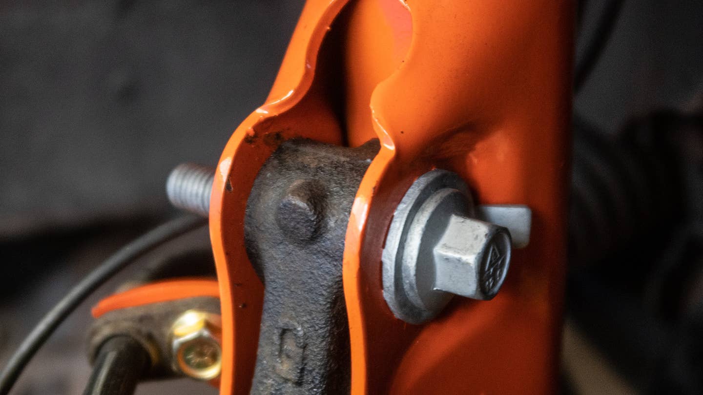 These camber bolts unlock more adjustability in your car's alignment. Their orientation affects camber. You'll need to do some research to figure out what settings are optimal for your car and equipment. <em>Andrew P. Collins</em>