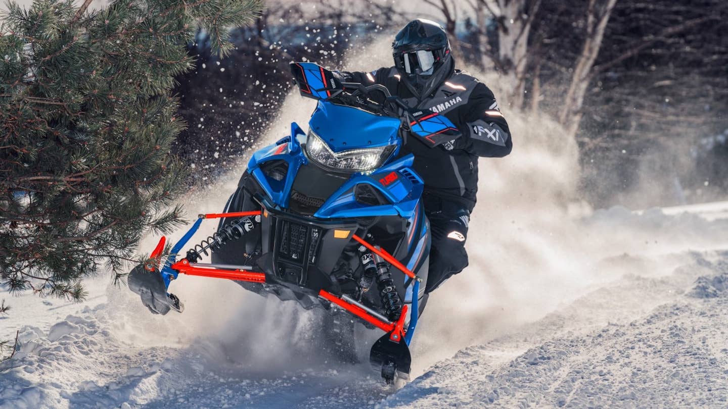 Yamaha snowmobile with its front skids off the ground