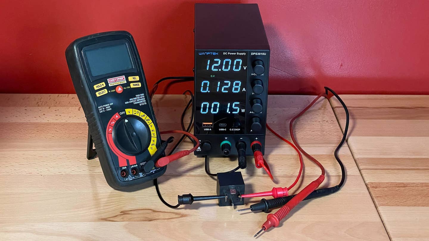 A simple benchtop setup to test a relay using a power supply and multimeter. <em>Rob Stumpf</em>