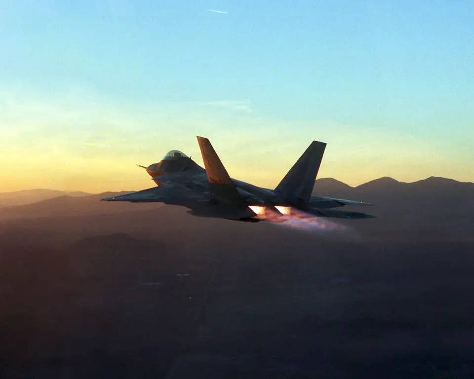 An F-22 with its afterburners engaged. <em>USAF</em>