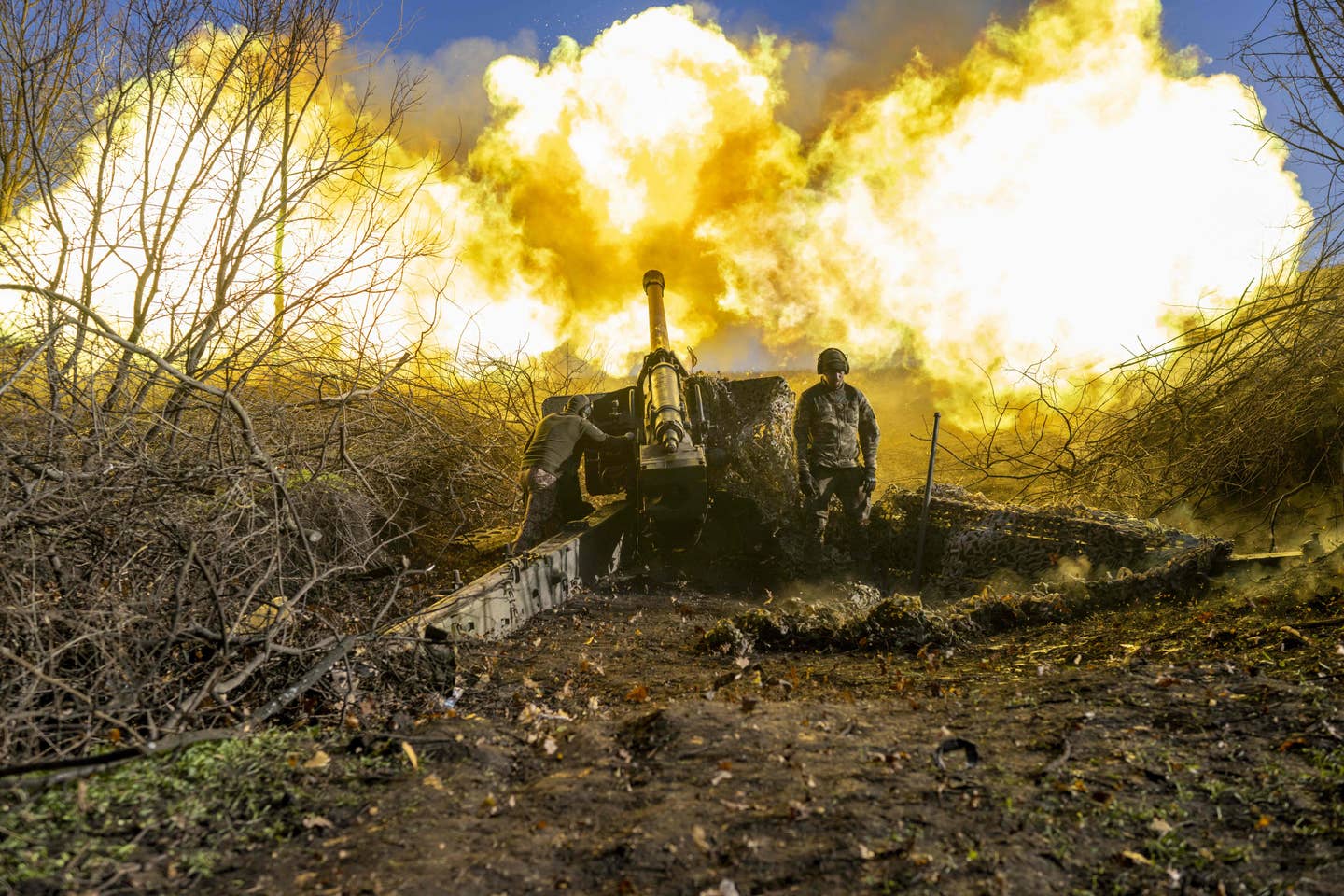 A Ukrainian artillery unit fires towards Russian positions outside Bakhmut. (Photo by BULENT KILIC/AFP via Getty Images)