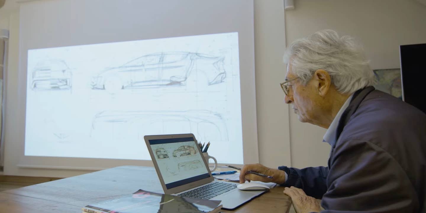 Giorgetto Giugiaro works on a laptop