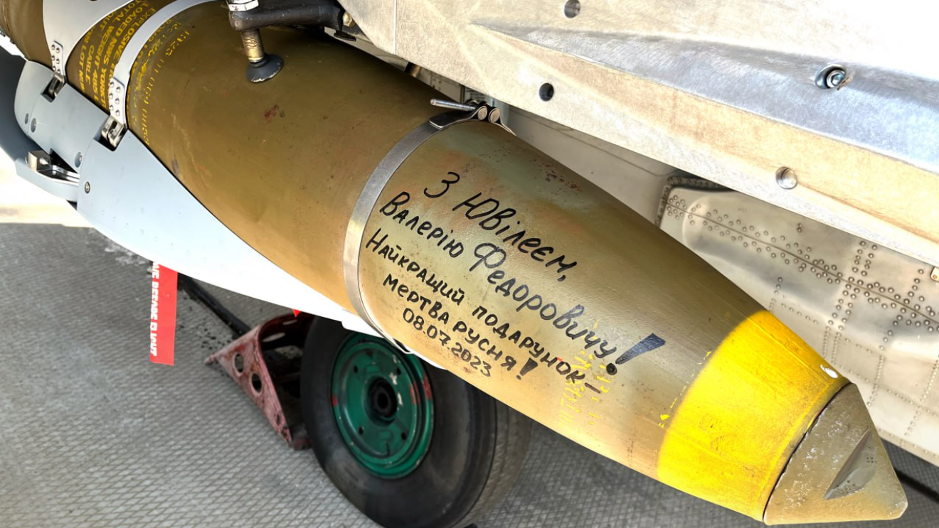 A Ukrainian MiG-29 carrying a JDAM-ER glide bomb. This one carries a slogan commemorating Ukraine Armed Forces commander-in-chief Valerii Zaluzhnyi’s birthday. <em>Ukrainian Air Force</em>