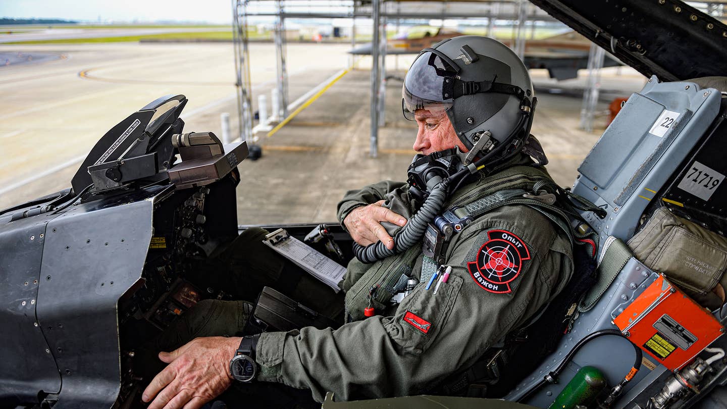 A Top Aces F-16A pilot prepares for a mission at Eglin AFB. <em>Jamie Hunter</em>