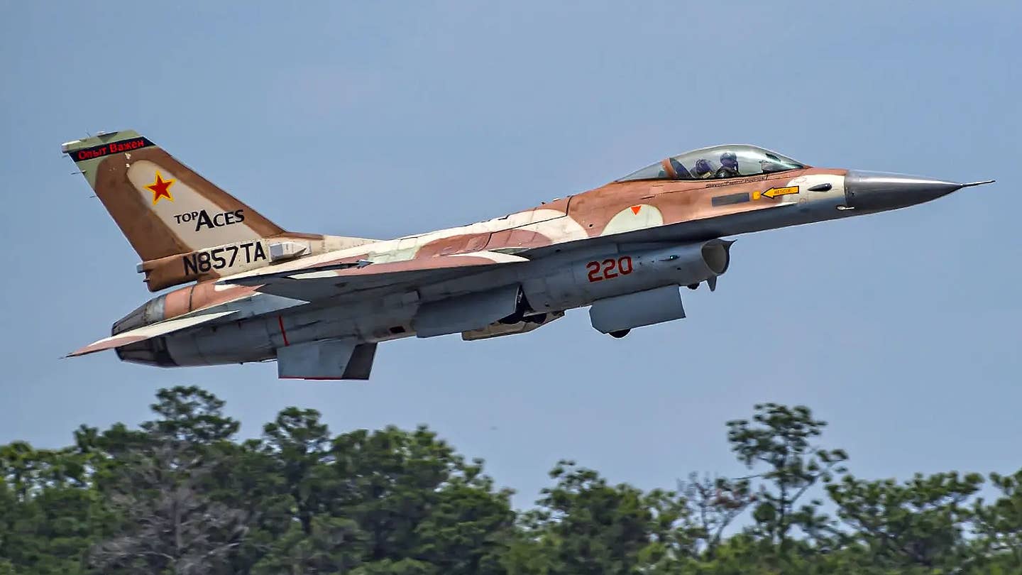 A Top Aces F-16A takes off from Eglin AFB.