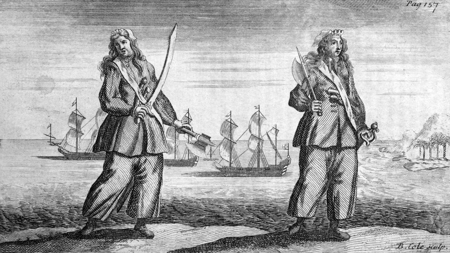 A copper engraving, circa 1724, showing the female pirates Ann Bonny and Mary Read. While the depiction of axes is likely fanciful, pirates were genuinely heavily armed, and cutlasses (a type of slashing sword) were a popular weapon. <em>Public Domain</em>