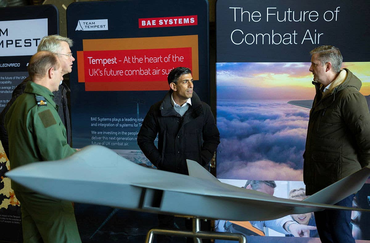 U.K. Prime Minister Rishi Sunak views a model showing one of several configurations for the Tempest future stealth fighter during a visit to RAF Coningsby last year. <em>Crown Copyright</em>