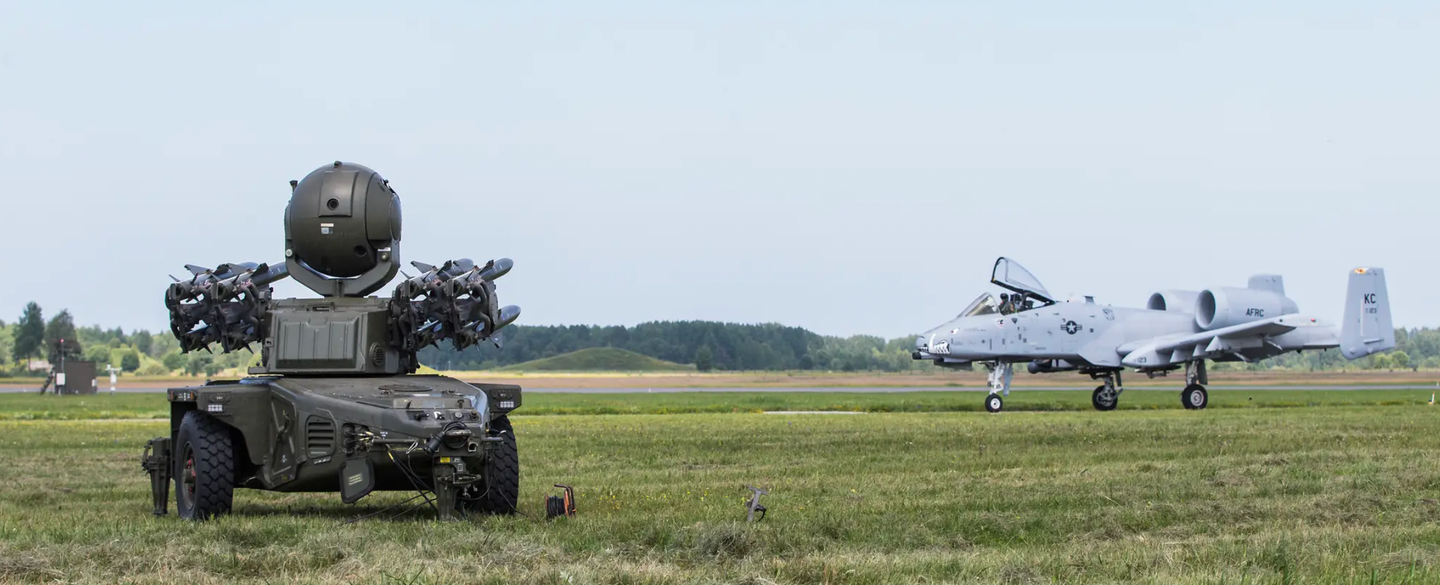 A British Army Rapier SHORAD system protects a runway while deployed to Estonia, while a U.S. A-10 taxis past.&nbsp;<em>Crown Copyright</em>