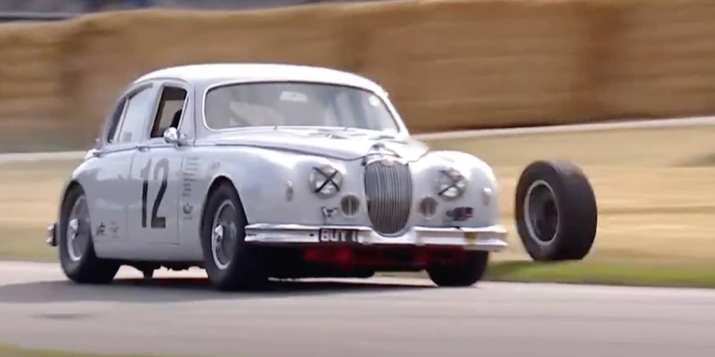 A 1959 Jaguar Mark 1 loses its left rear wheel at the 2023 Goodwood Hillclimb