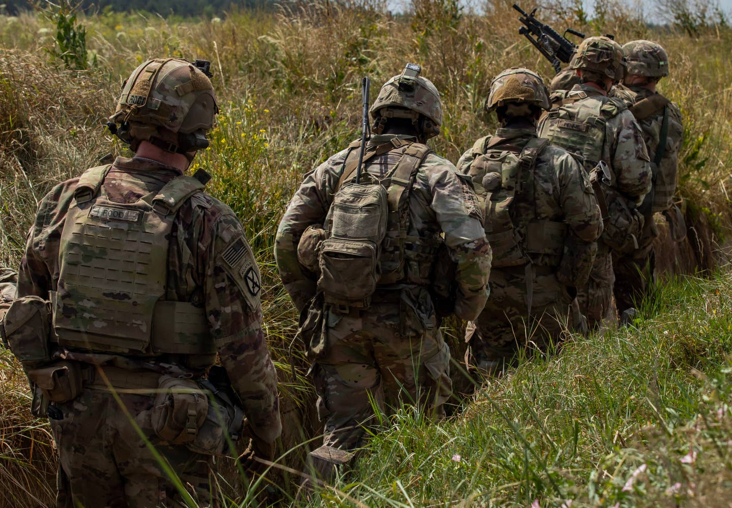 U.S. Army Soldiers with Charlie Company, 1st Battalion, 9th Cavalry Regiment, 1st Cavalry Division, supporting the 4th Infantry Division, enter and clear a trench during a live-fire exercise on a range at Bemowo Piskie Training Area, Poland, July 6. The 4th Inf. Div.'s mission in Europe is to engage in multinational training and exercises across the continent, working alongside NATO allies and regional security partners to provide combat-credible forces to V Corps, America’s forward deployed corps in Europe. (U.S. Army photo by Sgt. Alex Soliday)