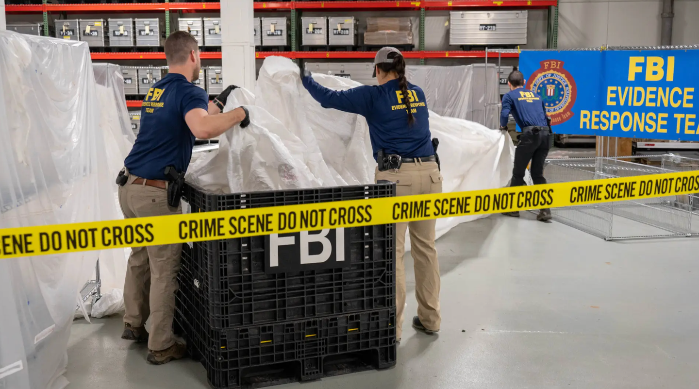 Members of the FBI process some of the remains of the Chinese surveillance balloon that was shot down on February 4, 2023, off the coast of South Carolina. <em>FBI</em>