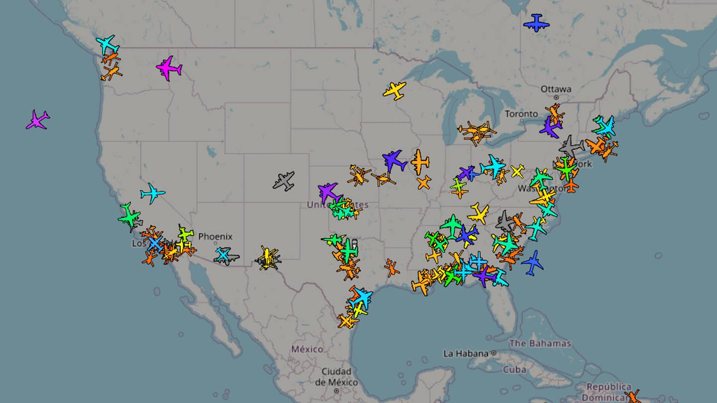A screen capture from online flight tracking website ADS-B Exchange showing a snapshot of military flights across the United States on July 18. <em>ADS-B Exchange</em>