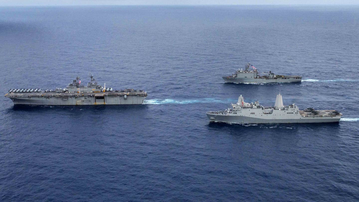 A trio of US Navy amphibious warfare ships: the amphibious assault ship USS <em>Wasp</em> (at left), the landing platform dock ship USS <em>San Antonio</em> (at bottom right), and the landing ship dock USS <em>Whidbey Island</em> (at top right). <em>USN</em>