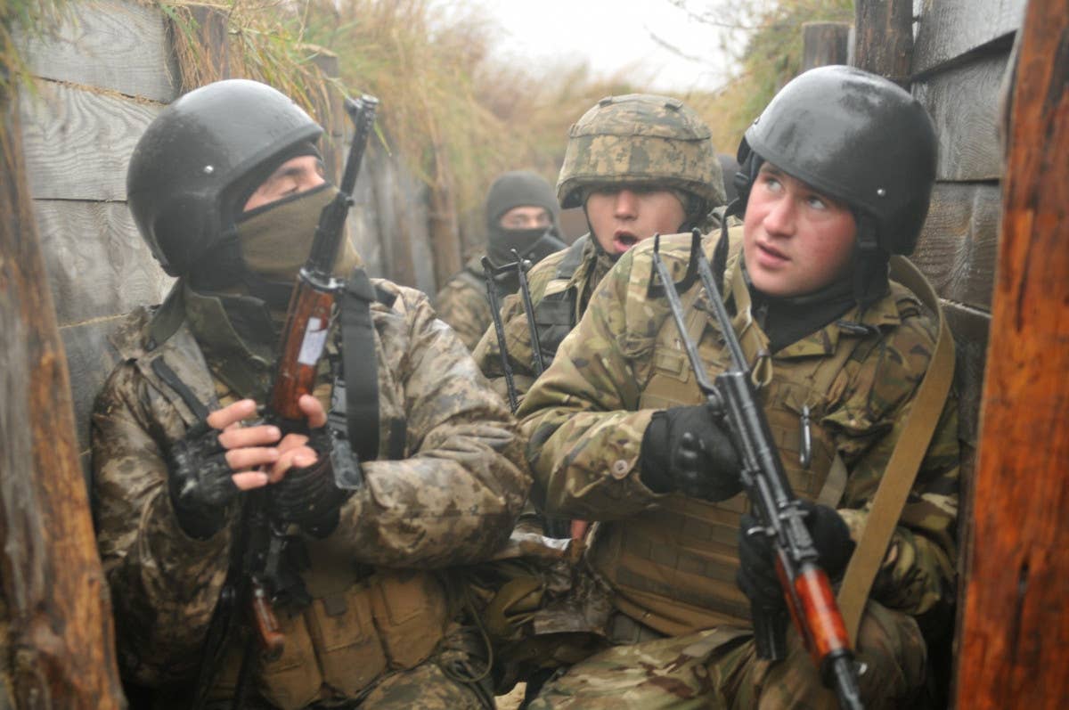 Ukrainian soldiers conduct trench-clearing training under the supervision of US Army personnel at the International Peacekeeping and Security Center in Yavoriv in 2016. <em>US Army</em>
