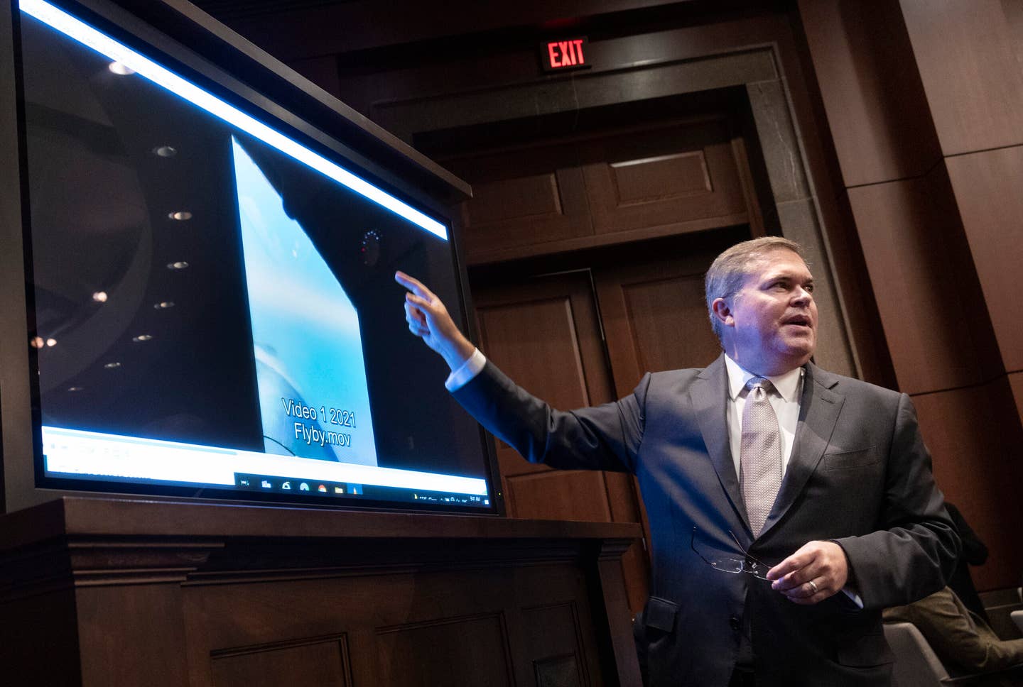 WASHINGTON, DC - MAY 17: U.S. Deputy Director of Naval Intelligence Scott Bray explains a video of unidentified aerial phenomena, as he testifies before a House Intelligence Committee subcommittee hearing at the U.S. Capitol on May 17, 2022, in Washington, DC. The committee met to investigate Unidentified Aerial Phenomena, commonly referred to as Unidentified Flying Objects (UFOs). (Photo by Kevin Dietsch/Getty Images)