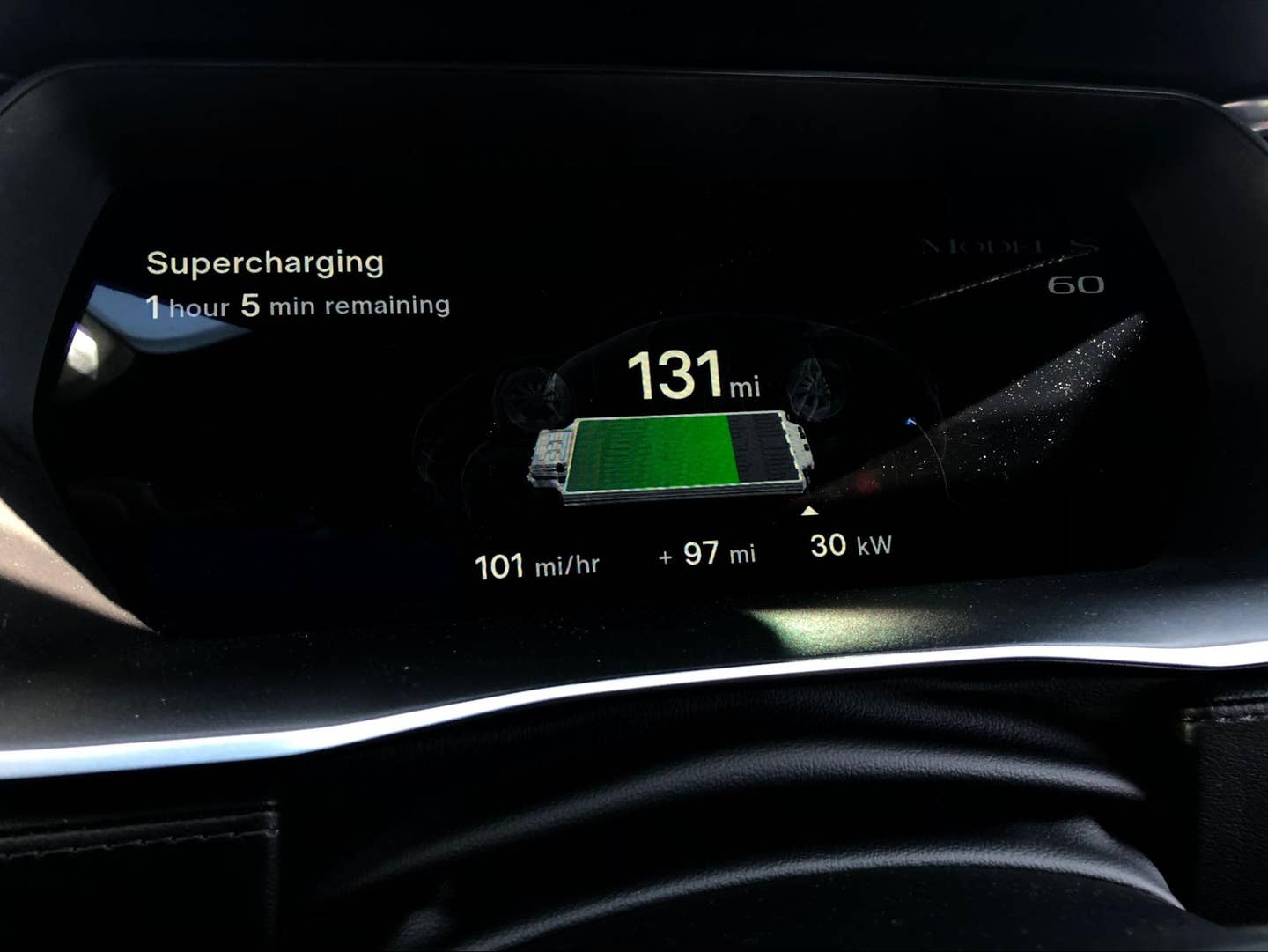 After 40 minutes on the Supercharger already, the Model S estimated another hour just to add 45 miles. <em>Joe Ligo</em>