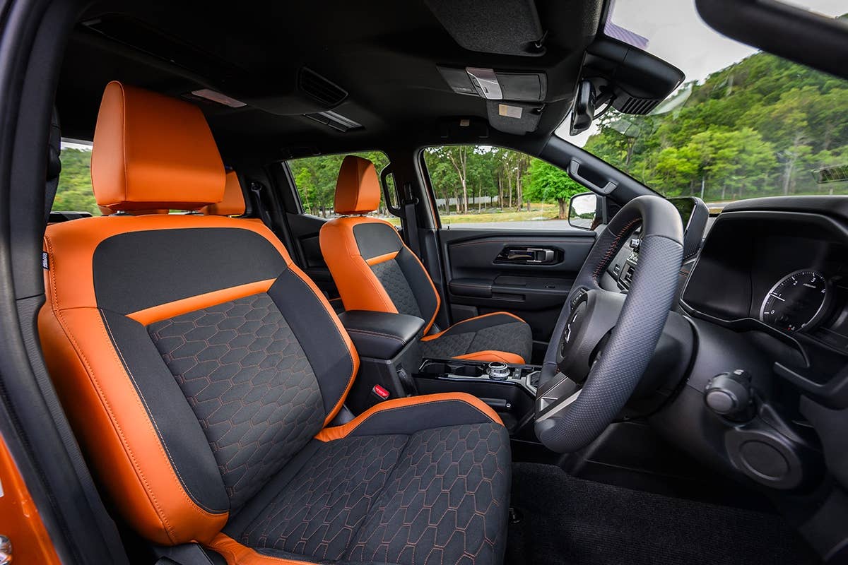 2024 Mitsubishi Triton front-row seats, trimmed in orange