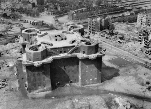 A heavily fortified <em>Flakturm</em>, or anti-aircraft artillery tower, in Hamburg, Germany, in April 1945. It is armed with four twin 12.8-cm <a href="https://en.wikipedia.org/wiki/12.8_cm_FlaK_40">Flak Zwilling 40</a> guns.<em> Australian War Memorial</em>