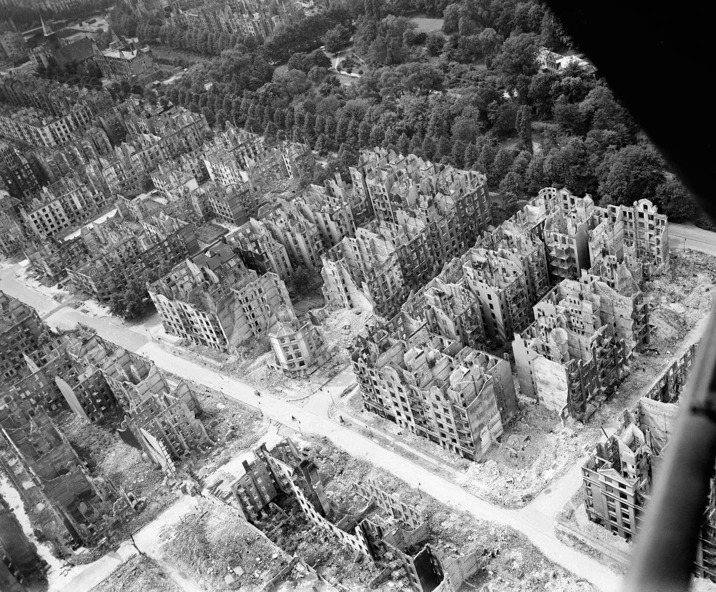 An oblique aerial view of ruined residential and commercial buildings in the Eilbek district of northeast Hamburg after the Bomber Command raid on the night of July 27/28, 1943. <em>Air Ministry</em>