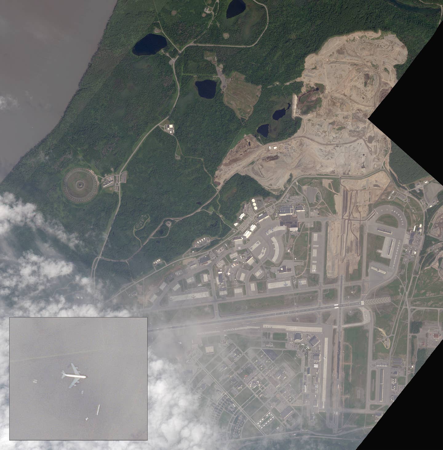 A satellite image of Elmendorf Air Force Base, formally part of  Joint Base Elmendorf-Richardson, taken on July 24th, 2023. Evidence of the runway extension "mega-project" is plainly visible at the northeastern end of the base. You can see an RC-135 Rivet Joint sitting on the southwest ramp area as well. <em><em>PHOTO © 2023 PLANET LABS INC. ALL RIGHTS RESERVED. REPRINTED BY PERMISSION</em></em>
