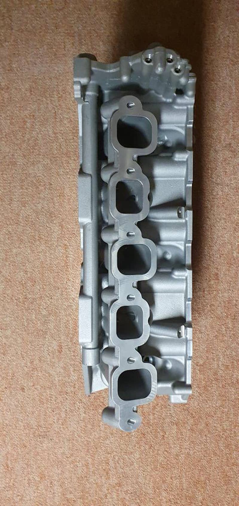 Volkswagen W10 engine prototype intake manifold with staggered intake port sizes