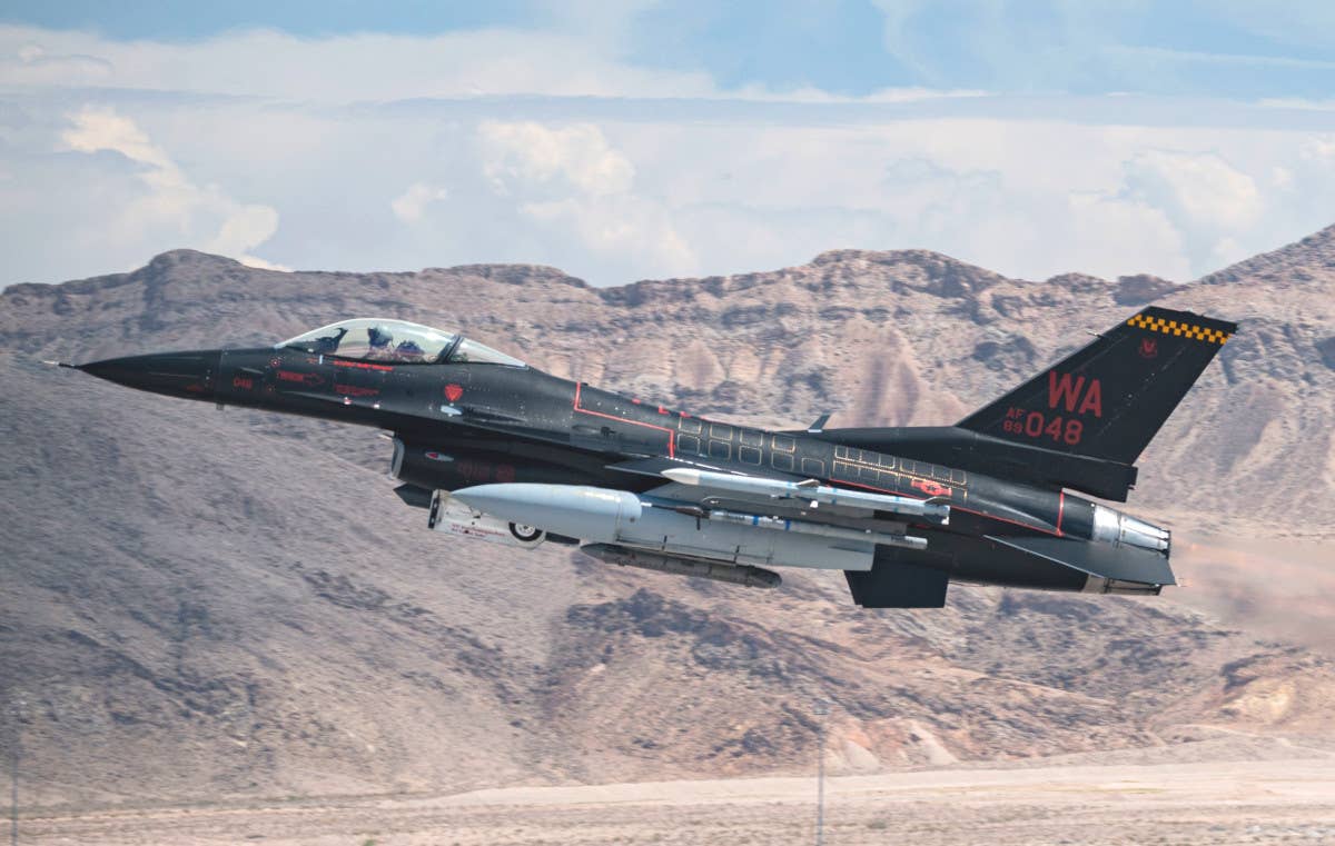 An aggressor F-16 takes off from Nellis Air Force Base during Red Flag 23-3. <em>USAF</em>
