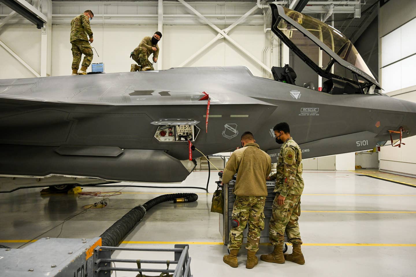 Maintainers perform maintenance on a F-35A Lightning II at Hill Air Force Base, Utah, March 18, 2021. (U.S. Air Force photo by R. Nial Bradshaw)