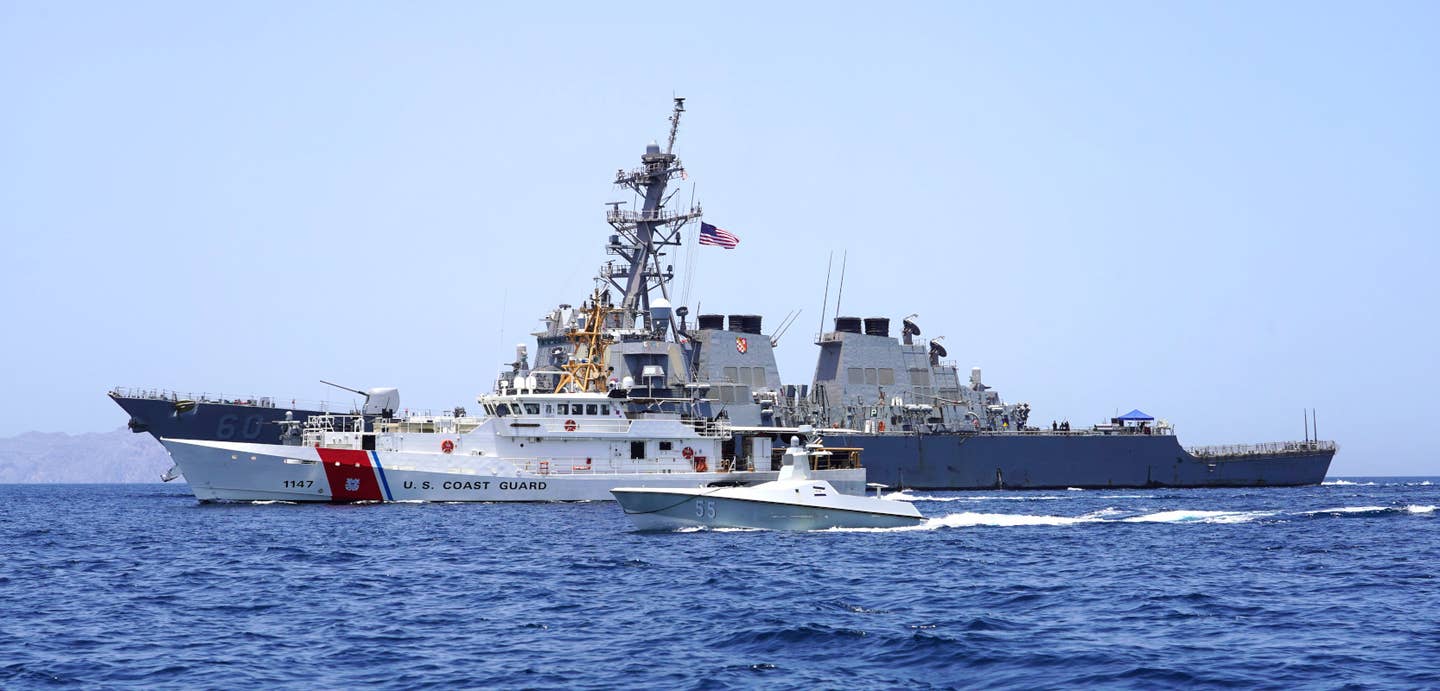 Arabian Fox, in front, alongside the US Coast Guard's <em>Sentinel</em> class cutter USCGC <em>Clarence Sutphin Jr.</em>, in the middle, and the Navy's <em>Arleigh Burke</em> class destroyer USS <em>Paul Hamilton</em>, at rear, during a previous transit of the Strait of Hormuz in May 2023. <em>USN</em>